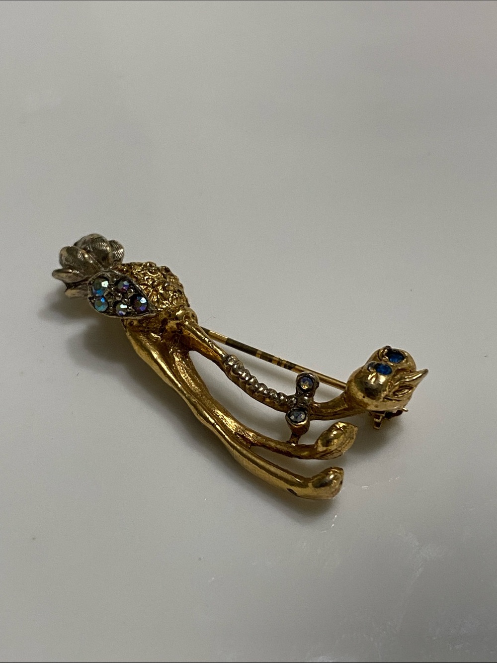 Gold Ostrich Brooch with Blue AB Crystal Accents